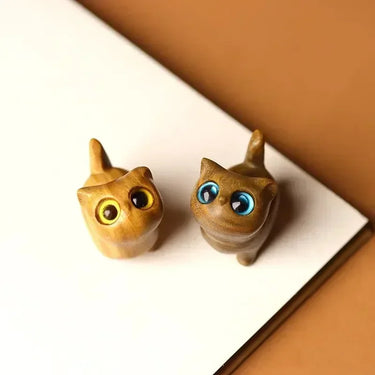 Add natural elegance to your home with two small KittyNook Cat Co. Handcrafted Wooden Kitten Figurines with colorful eyes.